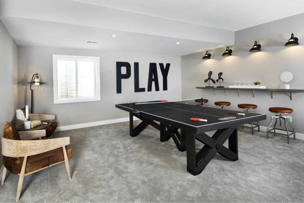 37+ Best Basement Game Room Ideas For Your Space 39 A black ping-pong table adds a sleek and modern touch to any game room