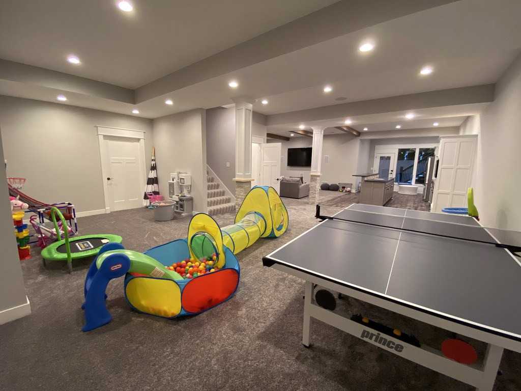 37+ Best Basement Game Room Ideas For Your Space 6 A family-friendly play zone helps parents supervise while bonding with kids