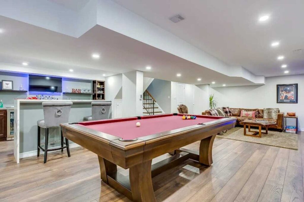 37+ Best Basement Game Room Ideas For Your Space 14 A mini bar elevates the basement experience with added entertainment