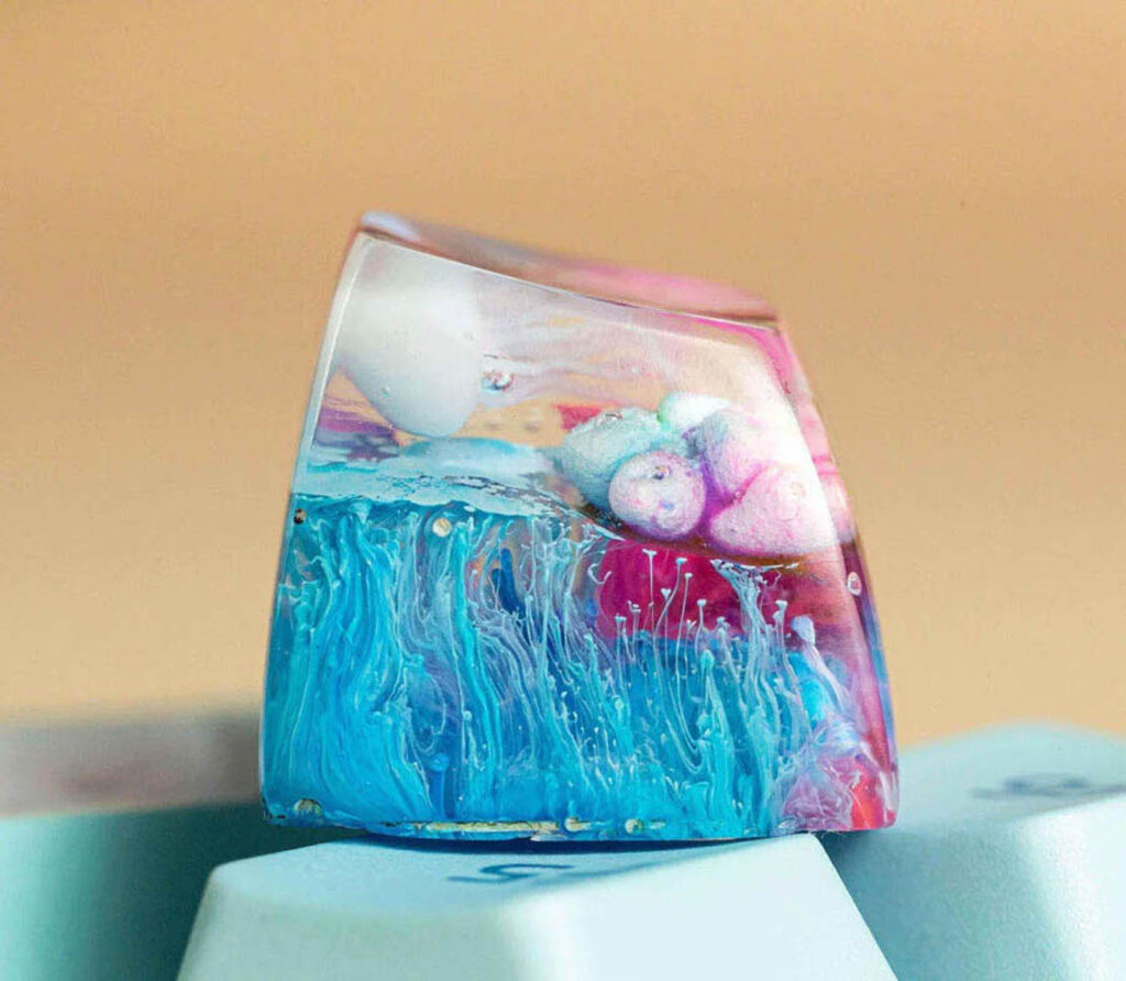 Custom Jellyfish Artisan Keycaps are custom keycaps that embody the ethereal beauty of jellyfish in a compact form
