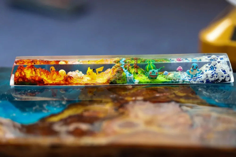 The custom Pokémon spacebar keycap features a dynamic scene across its extended surface 