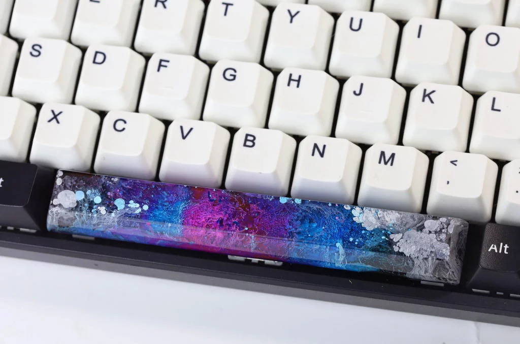 The keycap blends vivid resin tones and layered effects, offering a personalized pop of color 