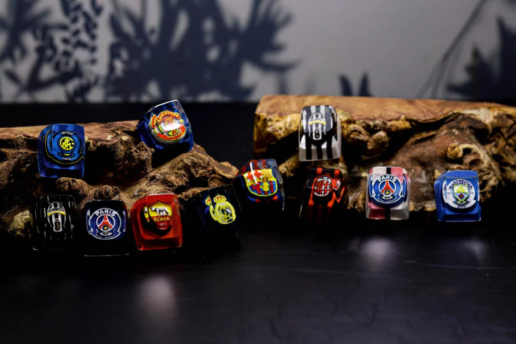 This football logo keycap represents team spirit through precision-carved design and team colors 