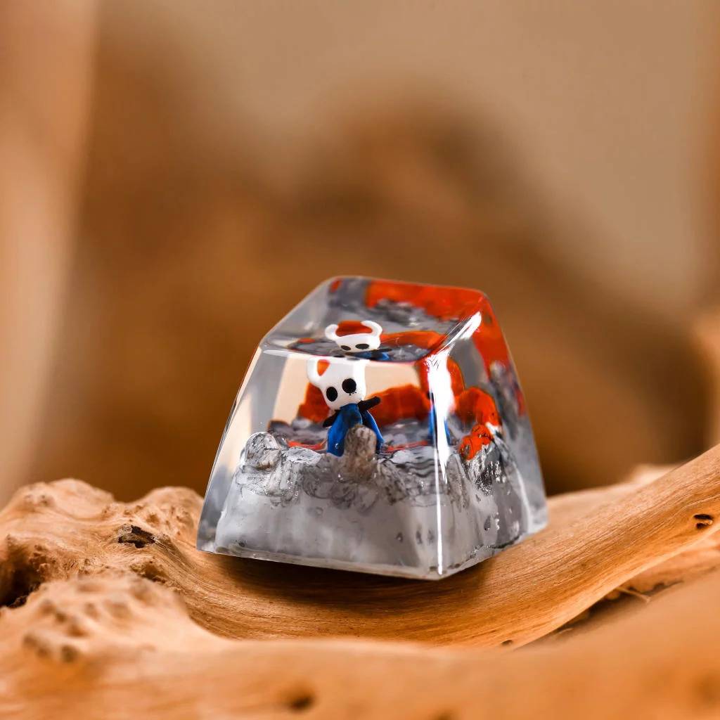 This Hollow Knight keycap captures the indie game's haunting elegance with a sculpted miniature of the main character