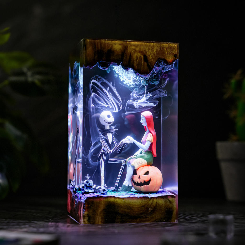 Jack and Sally resin lamp - front-facing proposal scene illuminated by blue and purple LEDs with glowing smoke effects