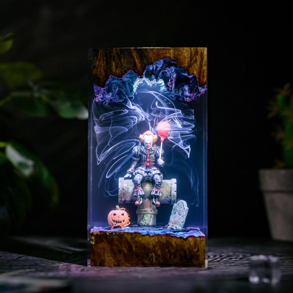 Pennywise IT Sitting On Sewer Pipe Halloween Lamp - front view with white-blue light and smoke swirls