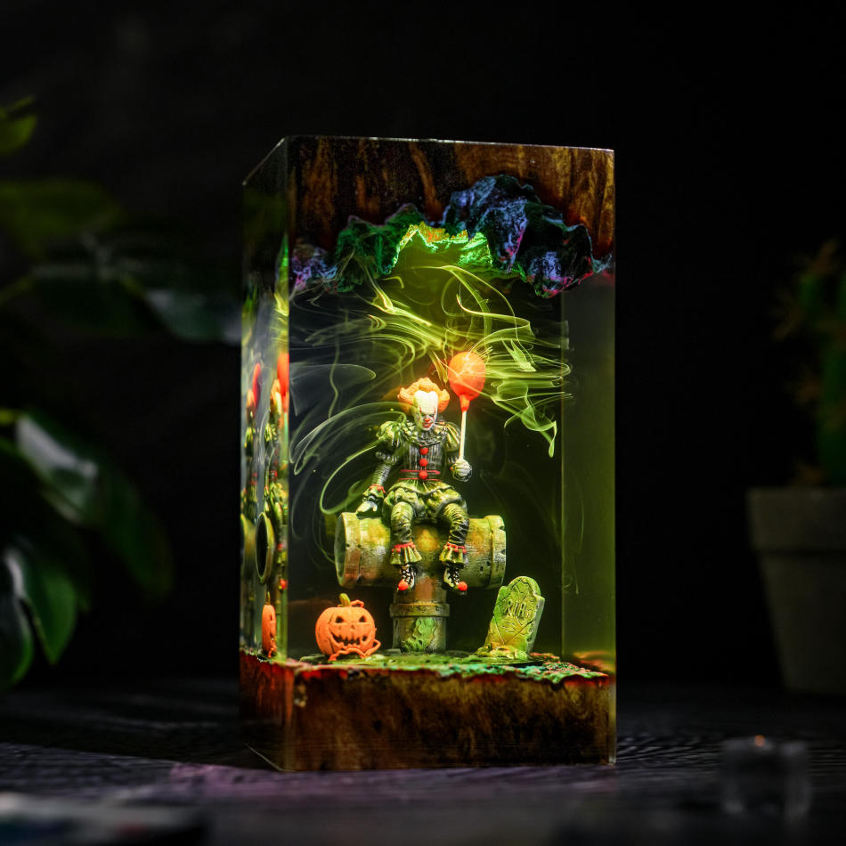 Pennywise IT Sitting On Sewer Pipe Halloween Lamp - side view with yellow-green light